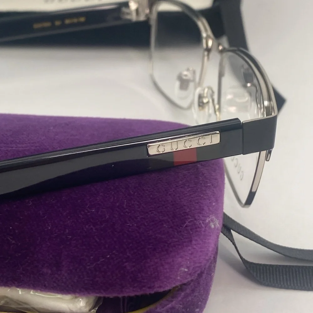 GUCCI GG0750O 001 square optical matte black and silver with shiny black frame.